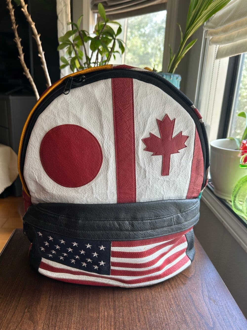 Vintage Wilsons Leather Multi-National backpack leather flag USA Japan Canada